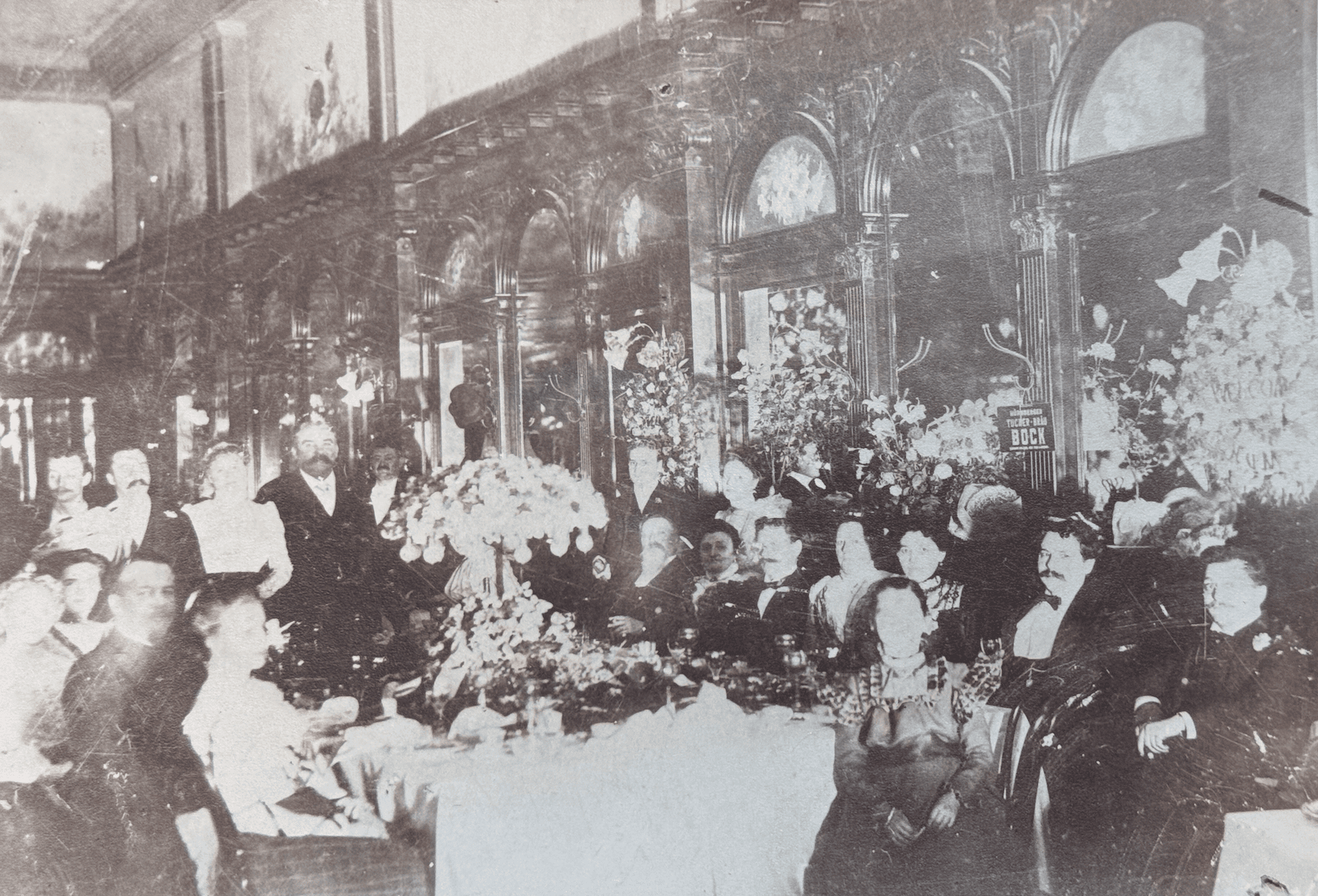 A picture in black and white of people at the zinkand café